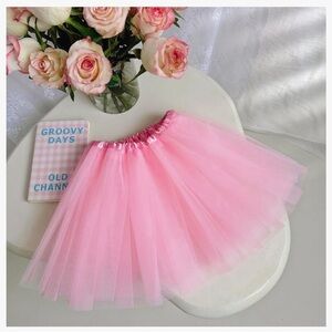 Pink tutu. Fits most little girls size 2-8. Brand new.
